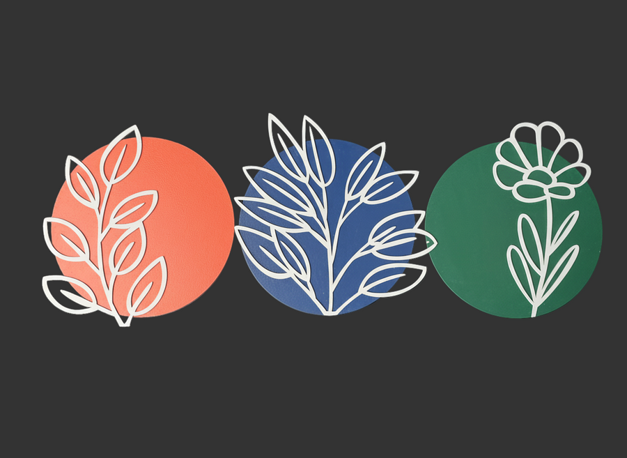 Three circular stickers with floral designs on a white background