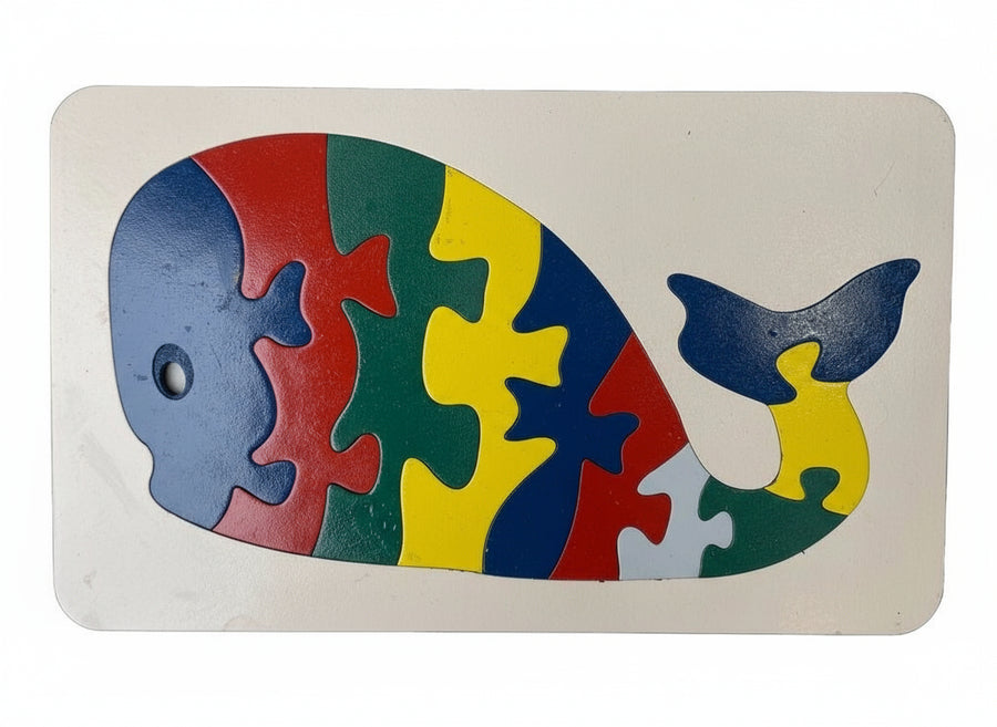 Colorful whale-shaped puzzle on a white background