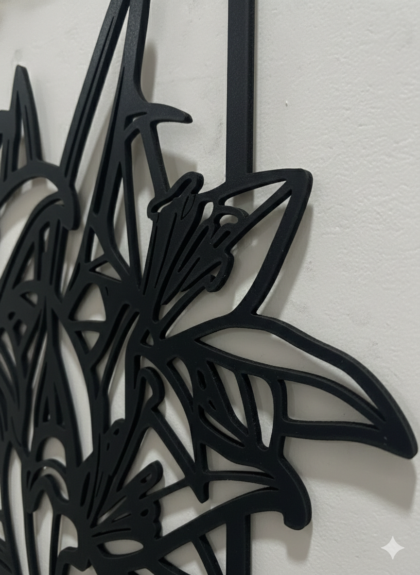 Black floral metal wall art on a white background