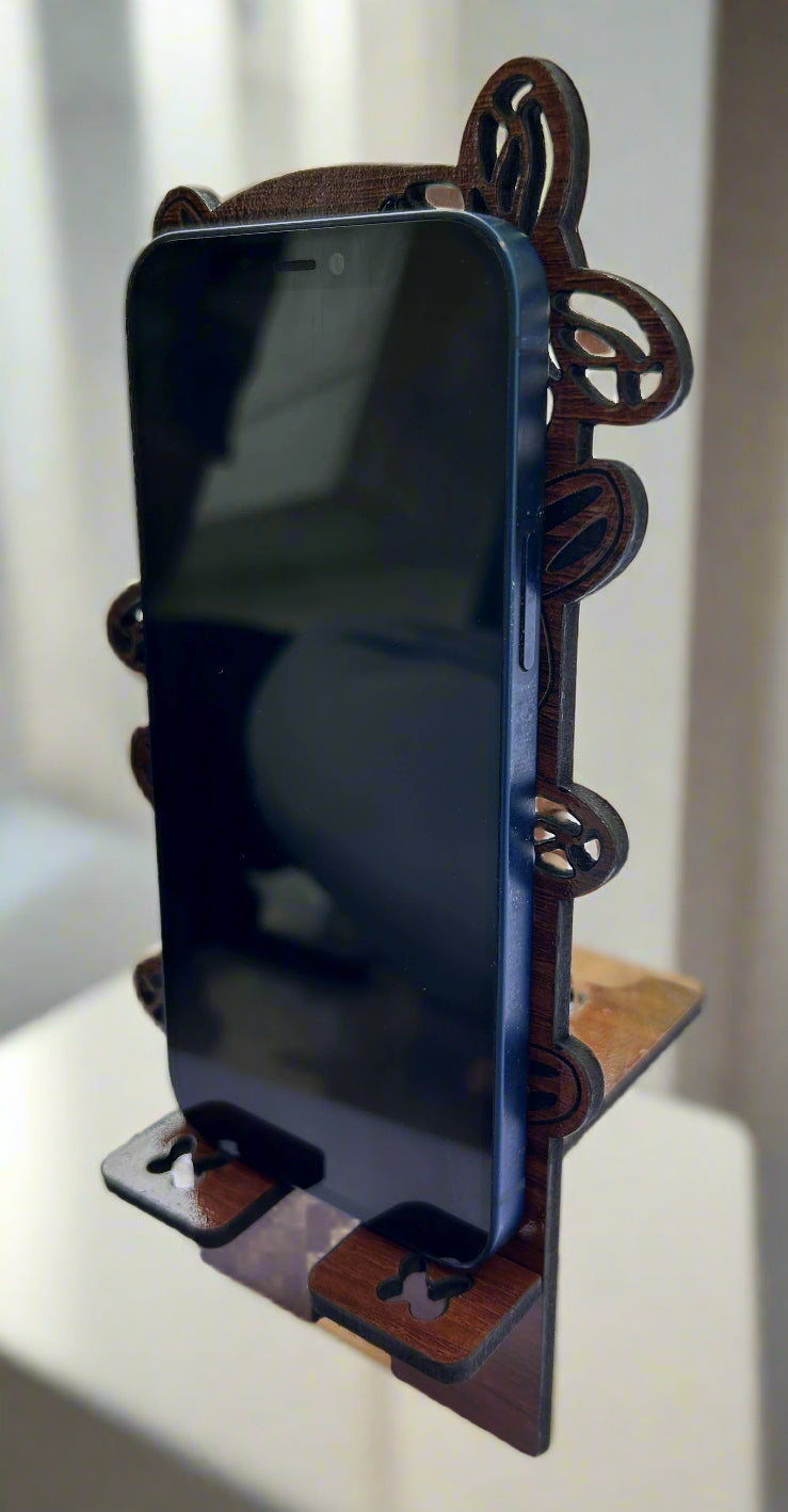 Smartphone on a wooden stand with a blurred background