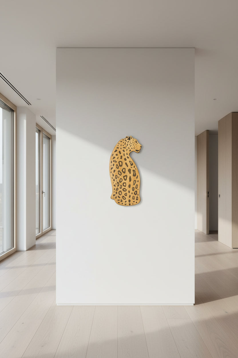 Leopard print wall art on a white wall in a modern interior setting
