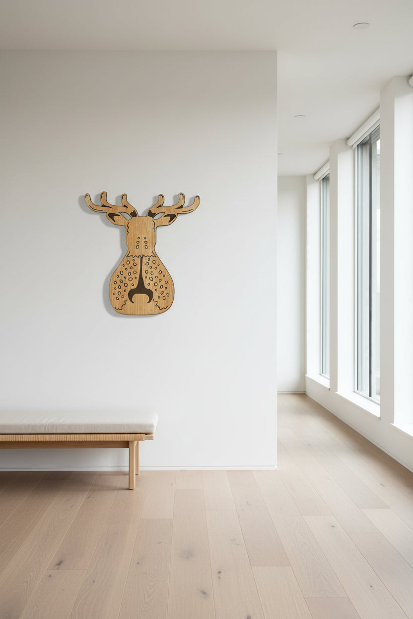Wooden deer head wall art in a minimalistic room with large windows.