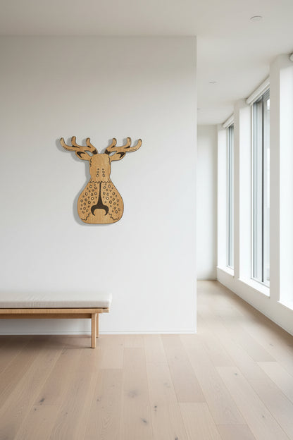 Wooden deer head wall art in a minimalistic room with large windows.