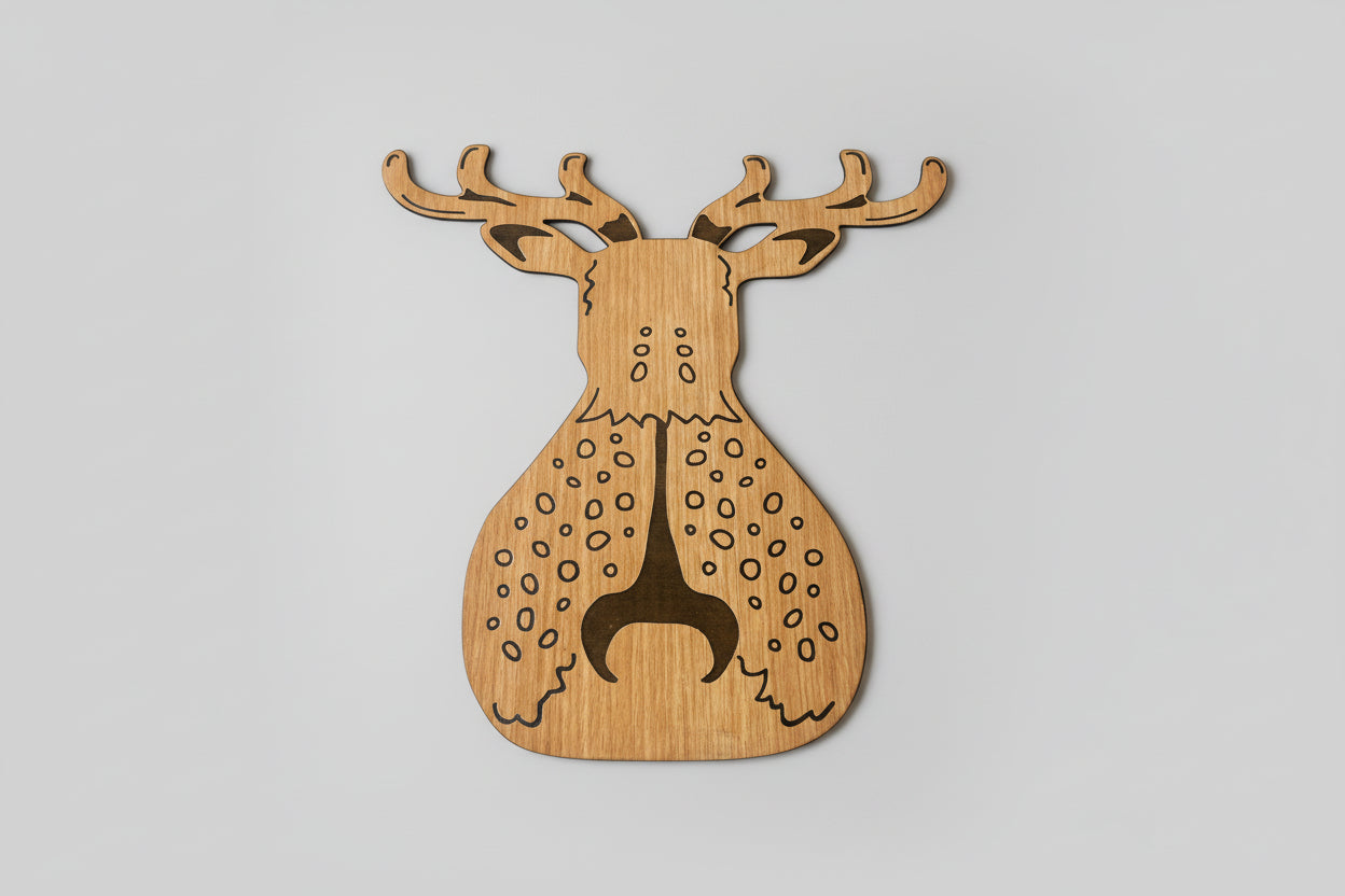 Wooden deer-shaped cutting board on a gray background